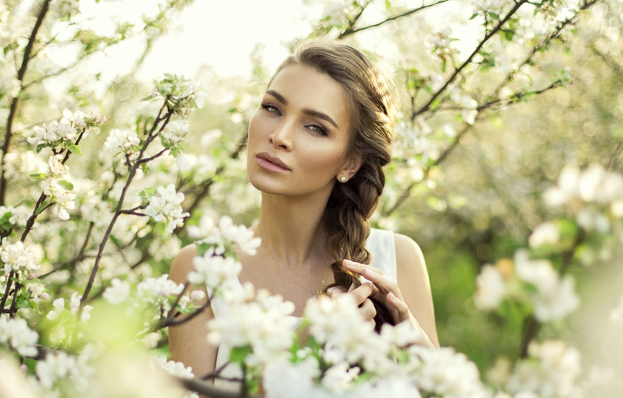 Portrait of beautiful natural woman make hair braid